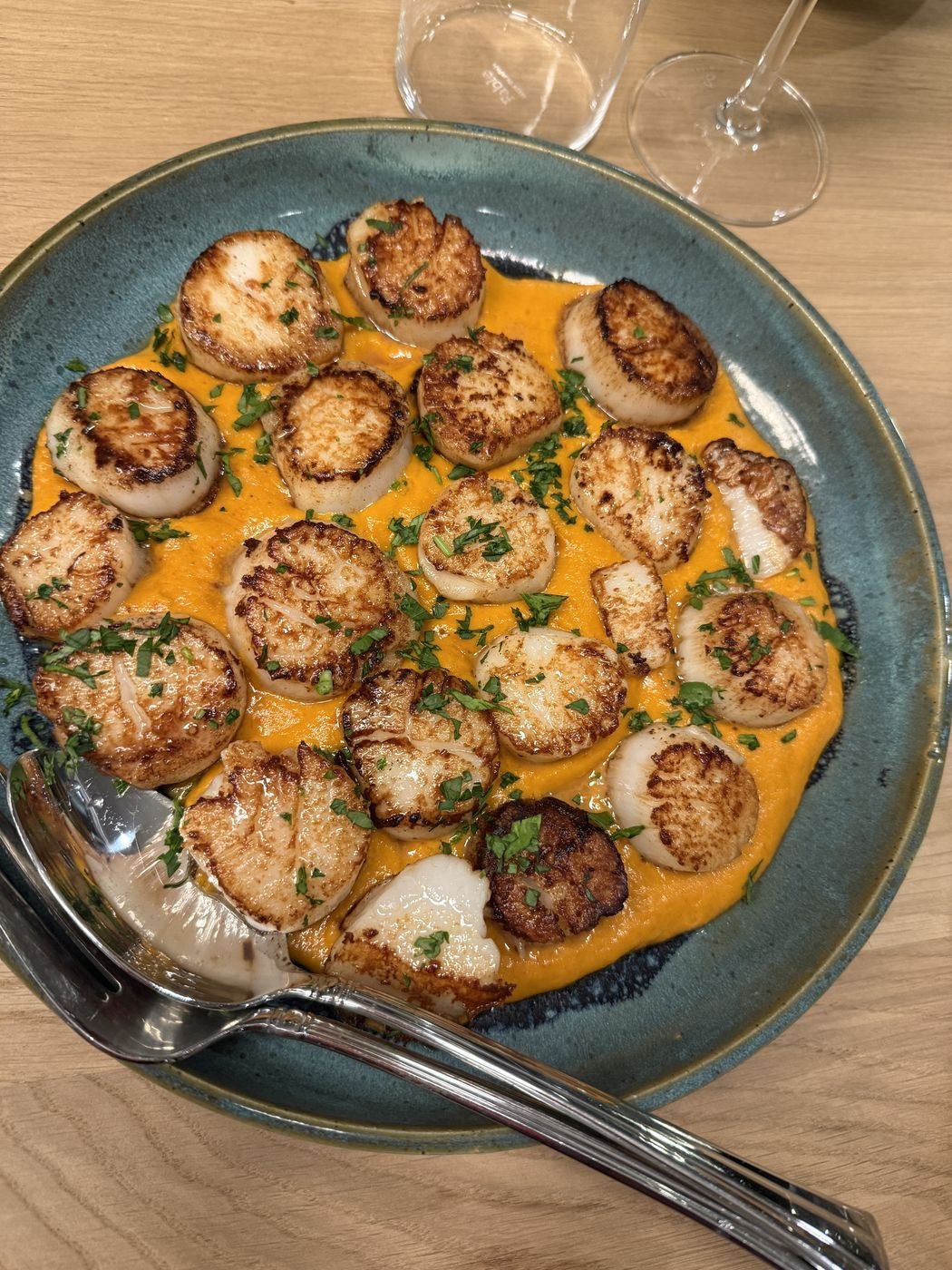 Seared scallops on a bright squash purée